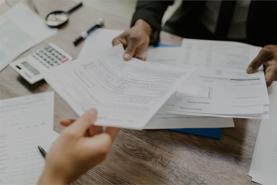 people exchange documents